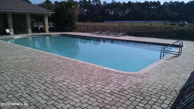 view of pool featuring a patio area