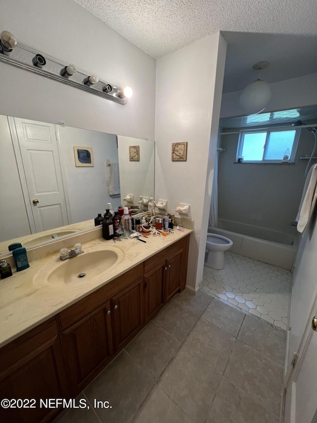 full bathroom with vanity, bathing tub / shower combination, tile patterned flooring, toilet, and a textured ceiling