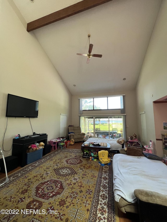 bedroom featuring beamed ceiling, high vaulted ceiling, and ceiling fan