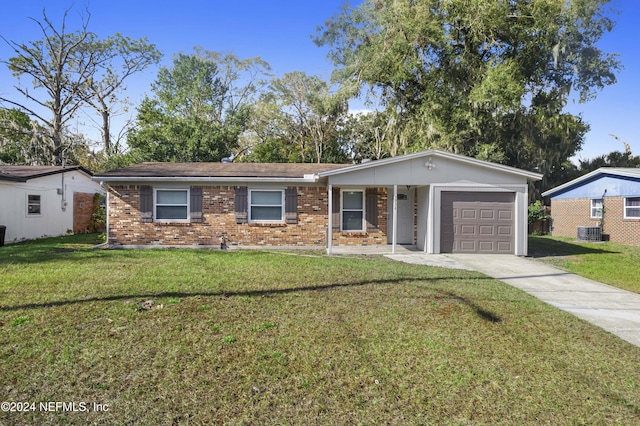 ranch-style home with central AC, a front yard, and a garage