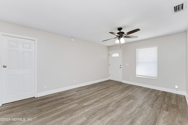 unfurnished room with ceiling fan and hardwood / wood-style floors