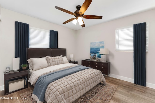 bedroom featuring ceiling fan and light hardwood / wood-style floors