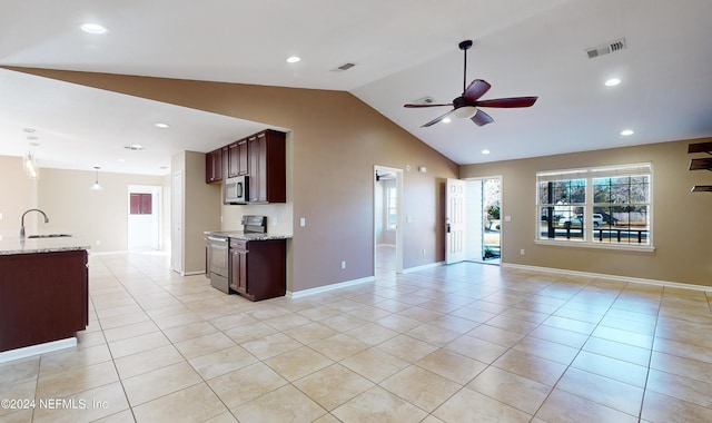 kitchen featuring lofted ceiling, sink, electric range, ceiling fan, and light stone countertops