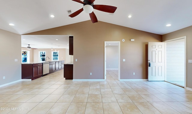 unfurnished living room featuring ceiling fan, sink, light tile patterned floors, and lofted ceiling with beams