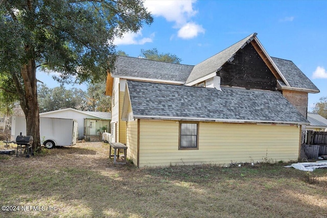 view of home's exterior with a lawn