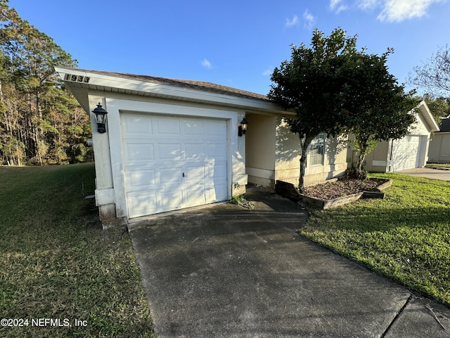 garage with a yard