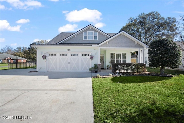 view of front facade featuring a garage and a front yard