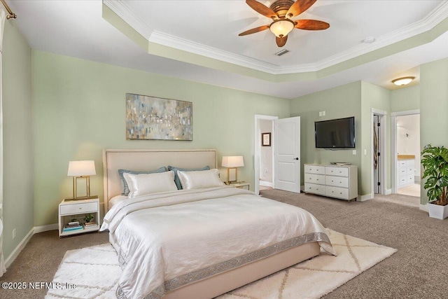 carpeted bedroom featuring a tray ceiling, ceiling fan, and crown molding