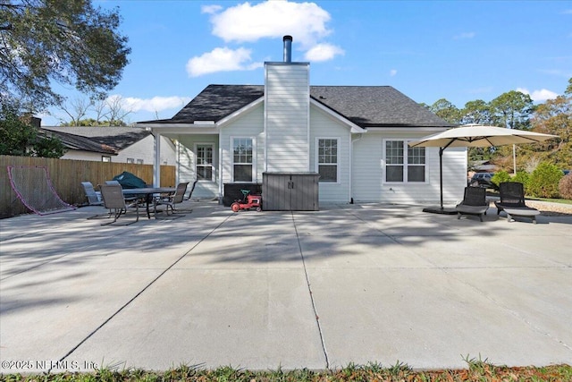 back of house with a patio