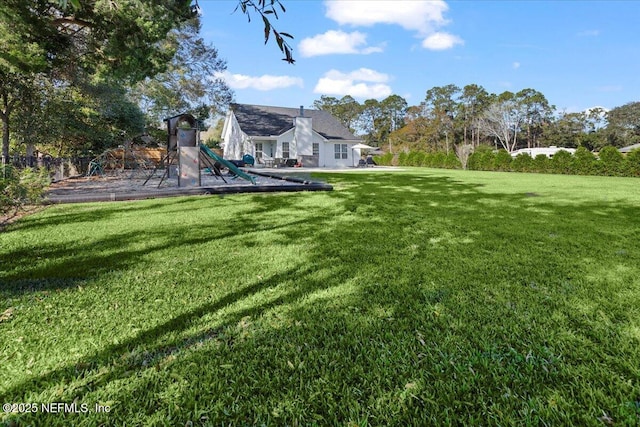 view of yard with a playground