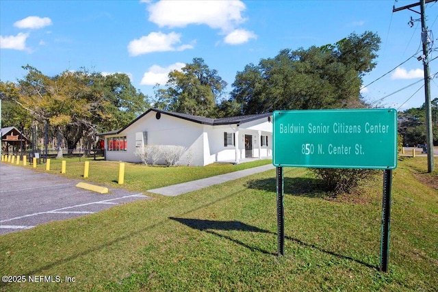 exterior space featuring a front lawn