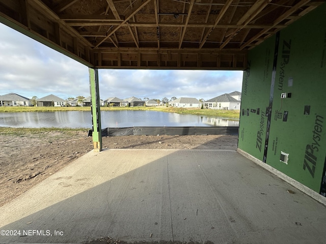 view of patio with a water view