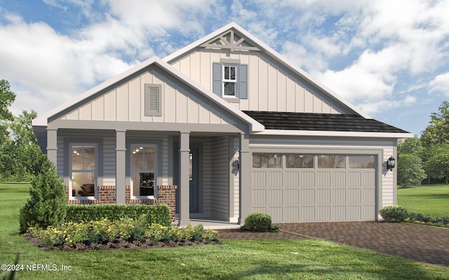 view of front of house with a garage, covered porch, and a front lawn