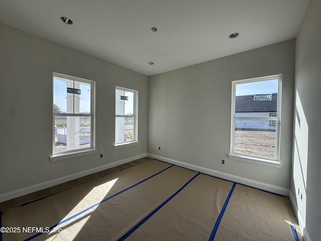 empty room featuring baseboards