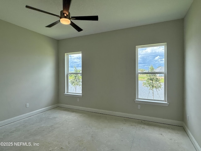 373 Lamego Ln, Saint Augustine, FL 32095 - spare room with healthy amount of natural light, a ceiling fan, and concrete flooring