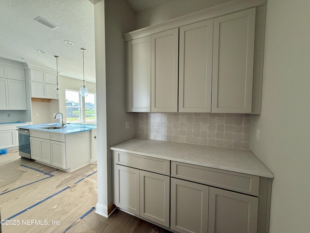 373 Lamego Ln, Saint Augustine, FL 32095 - kitchen featuring tasteful backsplash, light wood-type flooring, and dishwasher