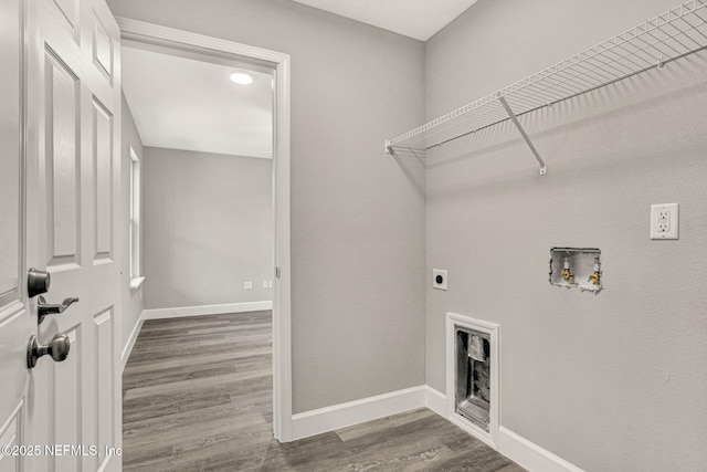 laundry area featuring hookup for an electric dryer, hookup for a washing machine, and hardwood / wood-style floors