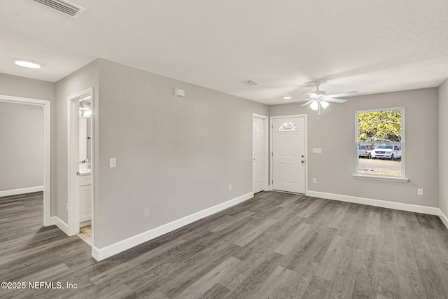 spare room with wood-type flooring and ceiling fan