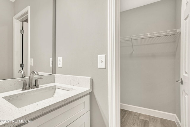 bathroom with vanity and hardwood / wood-style floors