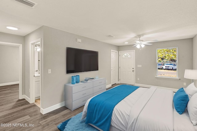 bedroom with ceiling fan and hardwood / wood-style floors