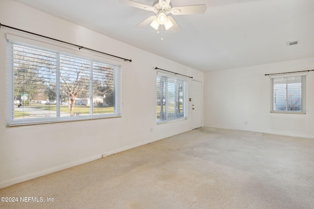 carpeted empty room with ceiling fan