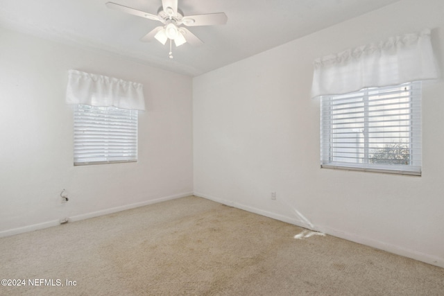 carpeted empty room with ceiling fan