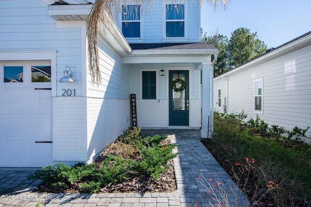 entrance to property featuring a garage