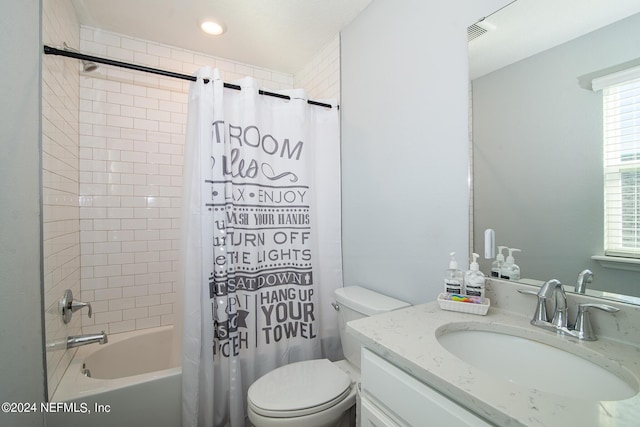 full bathroom with shower / tub combo with curtain, vanity, and toilet