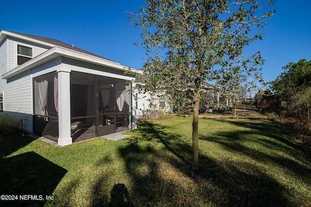 view of yard with a sunroom