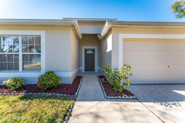 property entrance with a garage