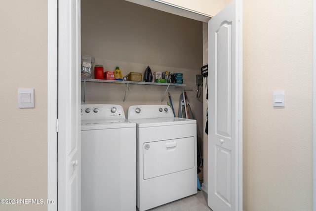 laundry area with washing machine and clothes dryer