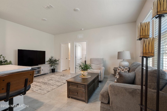 living room with plenty of natural light and light tile patterned flooring