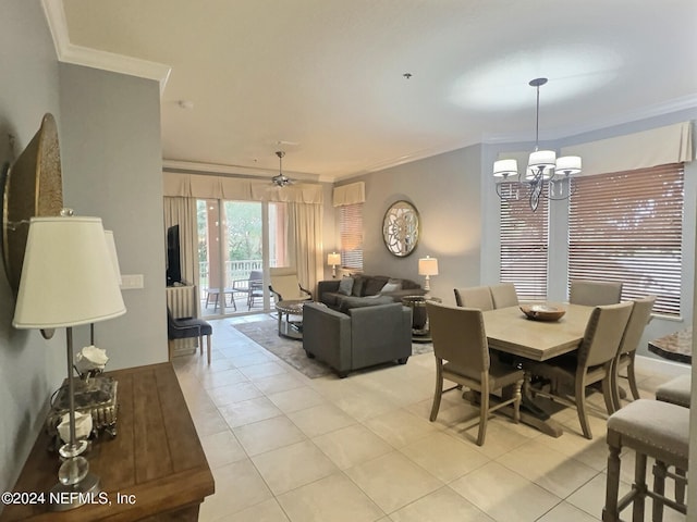 tiled dining space with crown molding and ceiling fan with notable chandelier