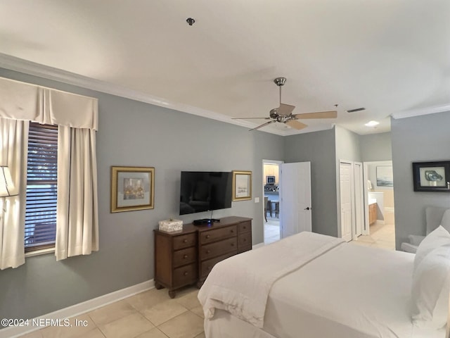 tiled bedroom with ceiling fan, crown molding, connected bathroom, and a closet