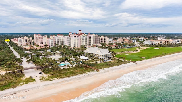 aerial view with a water view and a beach view