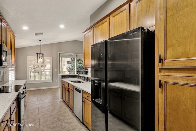 kitchen with sink, stainless steel appliances, pendant lighting, lofted ceiling, and light tile patterned flooring