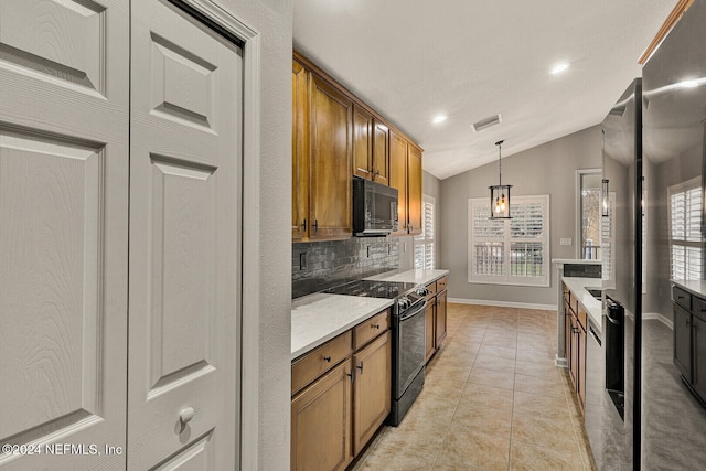 kitchen featuring backsplash, vaulted ceiling, black appliances, pendant lighting, and light tile patterned flooring