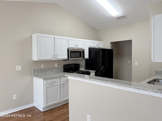 kitchen featuring light stone counters, dark wood-type flooring, white cabinets, and black appliances