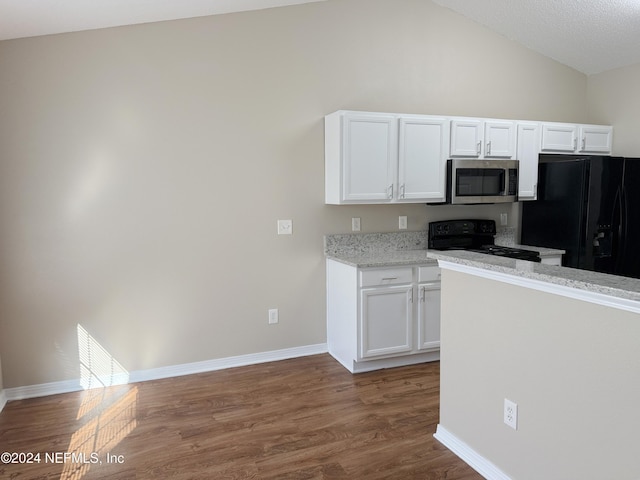 kitchen featuring black appliances, white cabinets, vaulted ceiling, light stone countertops, and dark hardwood / wood-style flooring