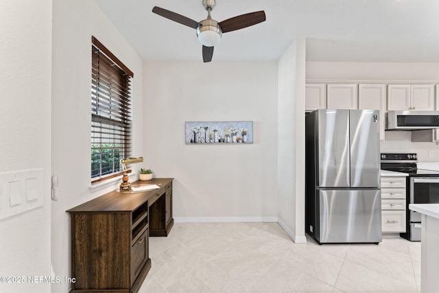 kitchen featuring light tile patterned flooring, ceiling fan, white cabinets, and stainless steel appliances