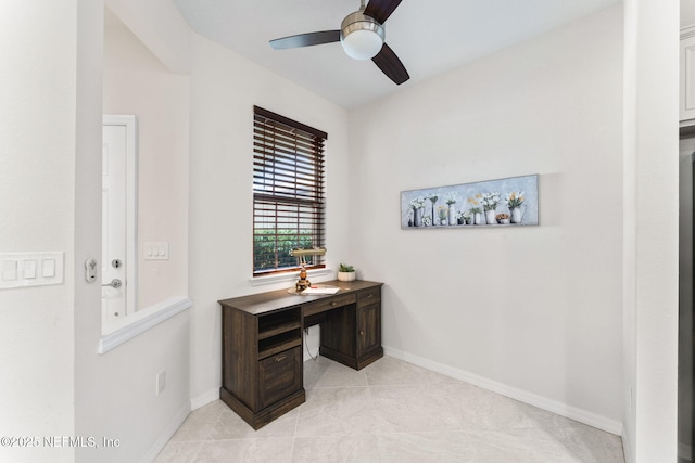 tiled office space with ceiling fan