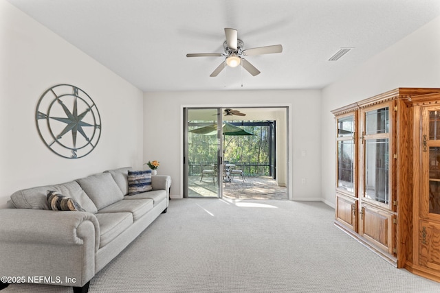 carpeted living room featuring ceiling fan