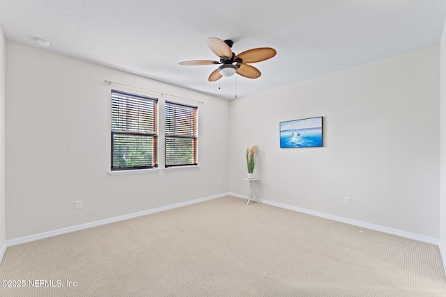 unfurnished room with light carpet and ceiling fan