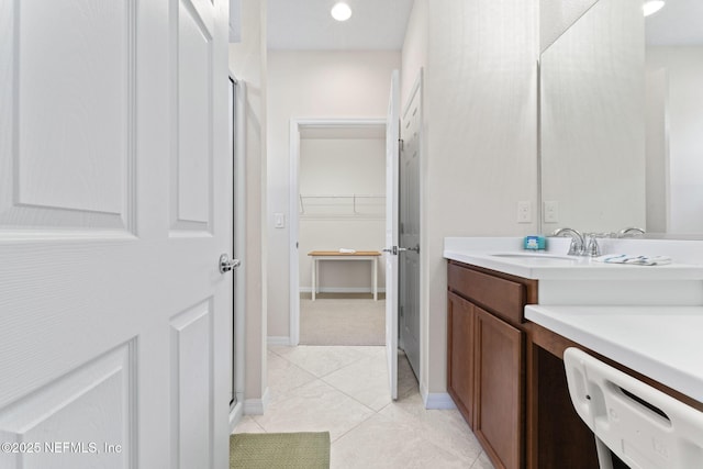 bathroom featuring tile patterned flooring and vanity