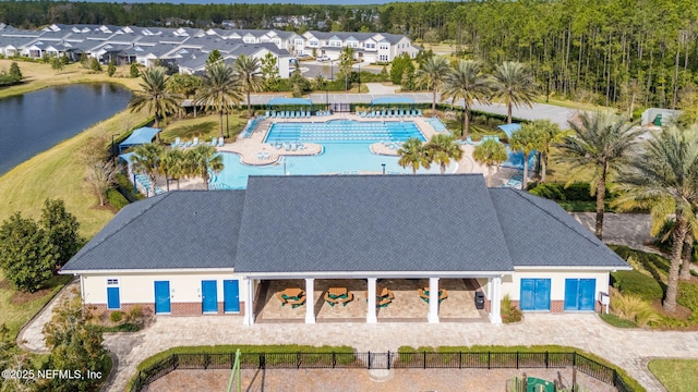 birds eye view of property with a water view