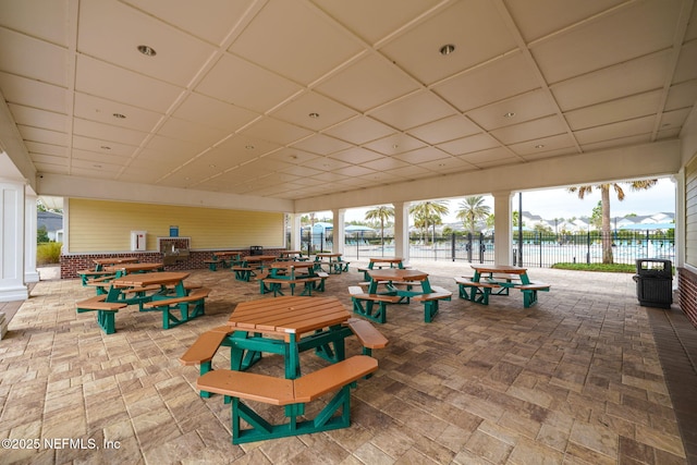 view of property's community featuring a patio area and a water view