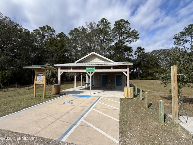 surrounding community with a patio and a lawn