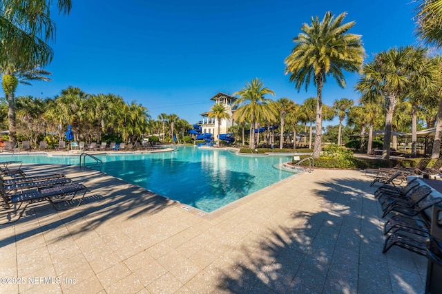 view of swimming pool featuring a patio area