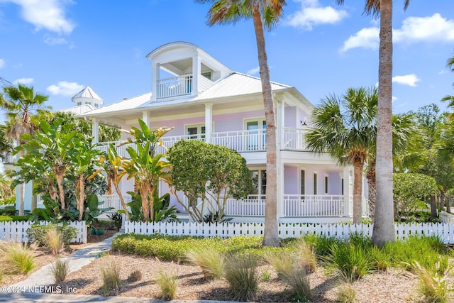 view of front of home with a balcony