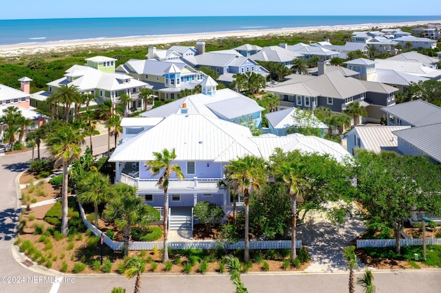 bird's eye view with a water view and a view of the beach